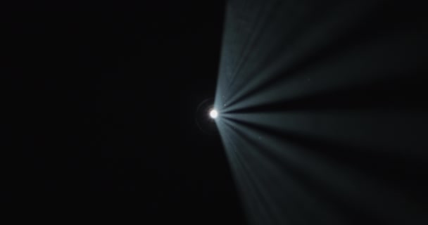 Hand Gripping White Rays Light Amidst Enveloping Darkness — Stock Video