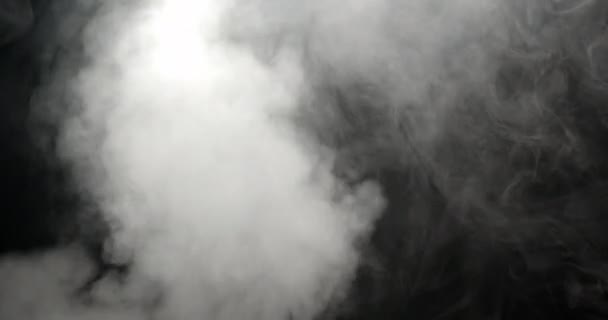White Smoke Envelops Air Being Blown Black Backdrop Slowly Dispersing — Stock Video
