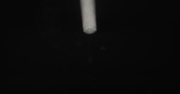 Spotlight Gracefully Tilts Downward Revealing Intricate Smoke Patterns Dark — Stock Video