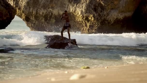Muay Thai Boxer Executes Powerful Punches Training Backdrop Coastal Rocks — Stock Video