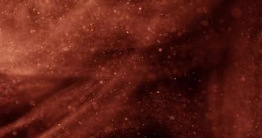 Yavaş, zarif bir hareketten hızlı, dinamik bir taşmaya akan parlak kumlar büyüleyici bir görsel etki yaratıyor.