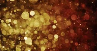 Koyu bir zemin üzerinde altın, kehribar ve turuncu tonlarda parlayan dairesel parçacıkların canlı bir sahnesi. Koyu arkaplandaki karşıtlık parçacıkların parlaklığını vurgular,