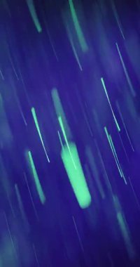 Canlı yeşil ve mor atomik girdap büyüleyici bokeh etkileriyle hareket halindeki dinamik enerjiyi yakalıyor.