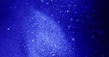 Beyaz kürelerin Bokeh etkisi, mavi arka planda parıldayan yıldızları anımsatıyor.