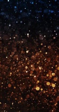 Yumuşak mavi ve turuncu Bokeh kıvılcımları, büyüleyici bir yavaş çekim ekranında yavaşça dans ediyor.