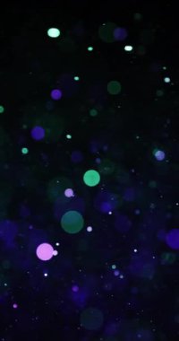 Yeşil ve menekşe dairesel parçacıklar karanlıkta yavaşça yüzerler ve dingin bir ortam oluştururlar.