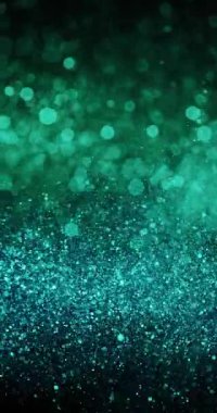 Canlı akuamarin ve yeşil parçacıklar koyu bir arka planda parlayarak enerji yayarlar.