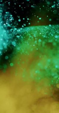 Cyan ve sarı parçacıkların büyüleyici girdapları pürüzsüz bir şekilde harmanlanır, büyüleyici bir görsel gösteriyle canlı yeşil renkleri ortaya çıkarır.