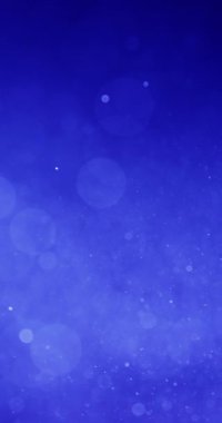 Koyu mavi bir arkaplan karşısında çeşitli boyutlarda beyaz ve açık mavi parçacıklar. Bu parçacıklar hareketi hatırlatan bir etki yaratır.