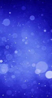 Koyu mavi bir ortamda çok sayıda parlayan parçacık yüzer. Arkaplandaki renklerin karanlıktan ışığa geçişi derinlik ve boyut duygusu ekler.