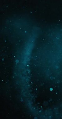 Derin mavi arkaplana karşı odak dışı parçacıkların çokluğu bir bokeh etkisi yaratır. Bu parçacıkların boyutları ve parlaklıkları küçük noktalardan büyük kürelere, daha parlak kürelere kadar değişiyor.