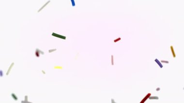 Rengarenk serpiştirmelerden oluşan canlı bir dizi beyaz arka plana hafifçe süzülür, canlı ve neşeli bir görüntü yaratır.