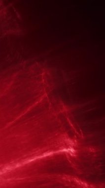 Canlı kırmızı ışık dalgaları, karanlık bir arkaplanı titretir ve aydınlatır. Büyüleyici ve dinamik bir görsel etki yaratır.