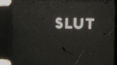 A minimalistic Slut end title in white text on a solid black background, featuring a grainy, retro 8mm film aesthetic