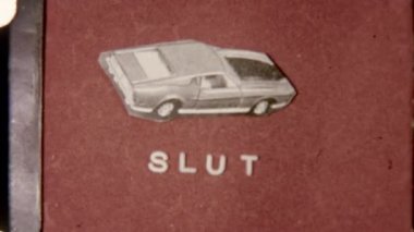 Film ending with the word Slut in bold text, accompanied by a car illustration, set against a vibrant red backdrop, creating a retro and dynamic visual effect