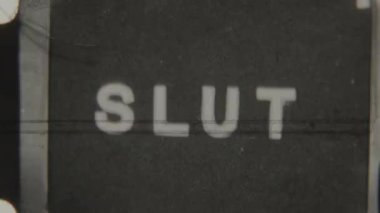 Classic 8mm film featuring the word Slut in bold all caps on a black background, transitioning to a blank red backdrop