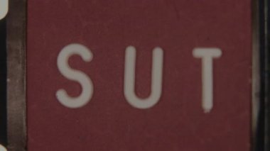 A playful animation showing the letter L entering and completing the word Slut in the end title, set against a clean background