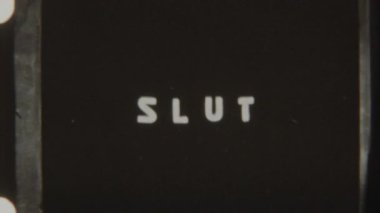 Retro 8mm film shows the word Slut shifting to Mille with vintage text distortions and analog flicker