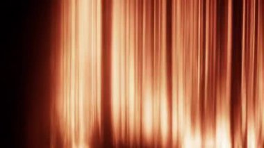 Dinamik turuncu ışık izleri siyah arkaplan boyunca sorunsuzca hareket ederek, enerjik ve soyut bir görsel etki yaratır.