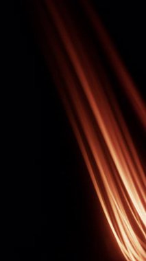 Parlak turuncu ateş, karanlık arka planda yavaşça hareket ederek dinamik ve büyüleyici bir görsel efekt yaratır.