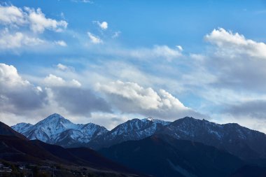 a beautiful shot of a snow capped mountain peaks
