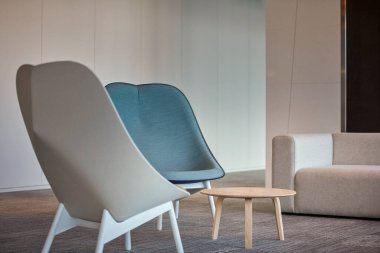 modern comfortable chair on wooden wall background