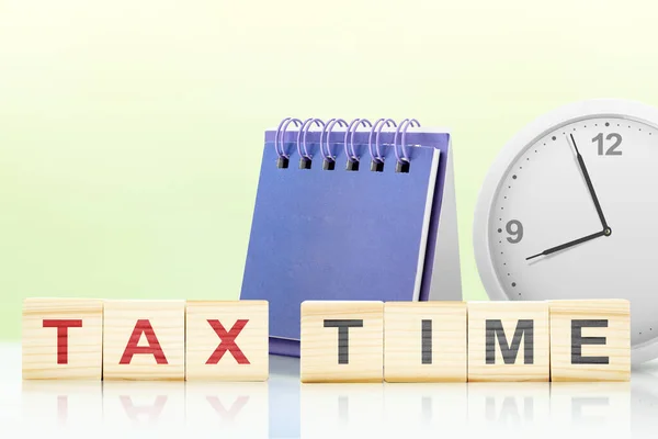 Clock and calendar with tax time text on a colored background