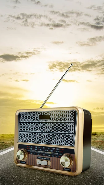 Old radio with sunset scene background. World Radio Day