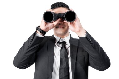 Asian businessman looking through binoculars isolated over white background