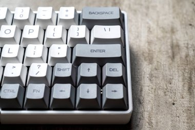 The mechanical keyboard on textured background