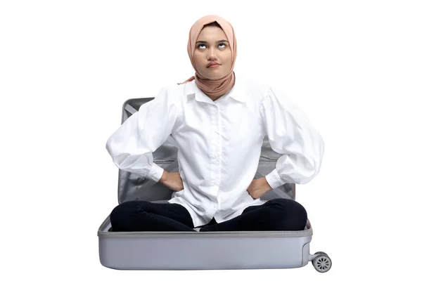 Asian Muslim Woman Headscarf Sitting Suitcase Upset Expression Isolated White — Stok fotoğraf