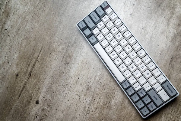 The mechanical keyboard on textured background