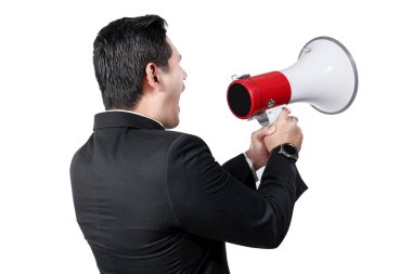 Rear view of Asian businessman shouting on megaphone isolated over white background