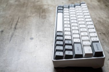 The mechanical keyboard on textured background