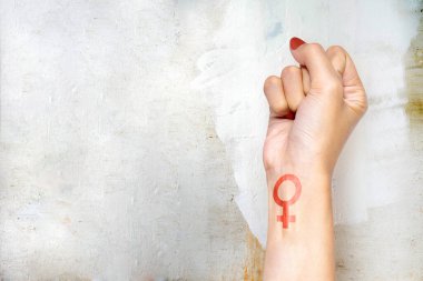 Woman hand with female symbol. International Women Day 