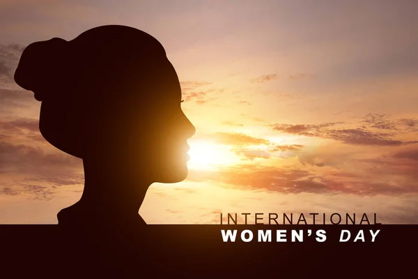 Silhouette of woman with International Women's Day text. International Women Day Concept