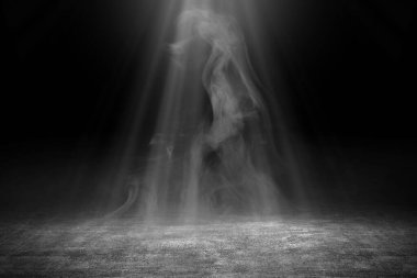 Concrete floor with white smoke on dark background