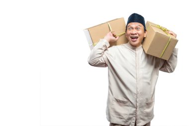 Asian Muslim man carrying box ready to mudik isolated over white background