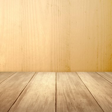 Wooden floor with colored wall background
