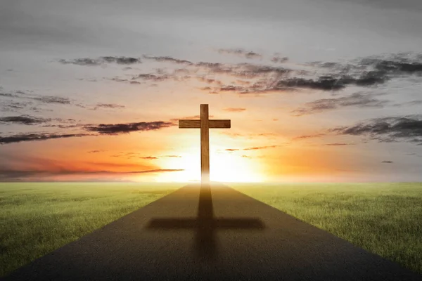 Christian Cross on the street with sunset sky background