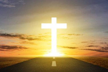 Christian Cross on the street with sunset sky background