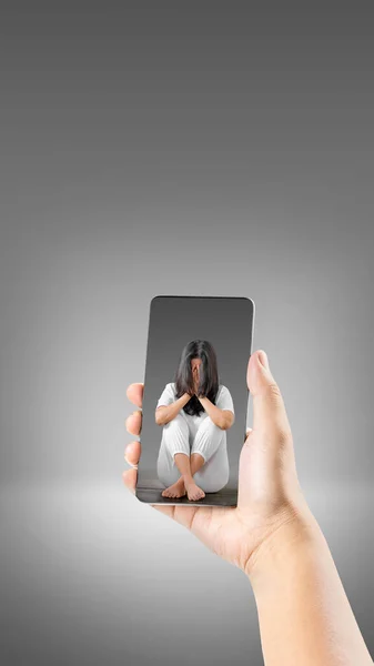 Human Hand Holding Mobile Phone Screen View Depressed Woman Sitting — Stock Photo, Image