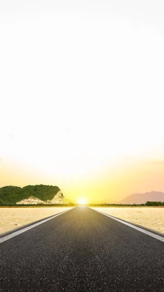 Asphalt road with a desert view and sunset scene background