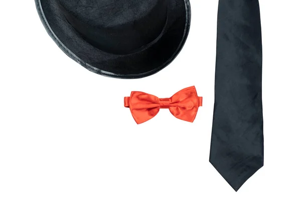 Black hat and black tie with red bow tie isolated over white background