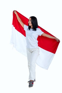Indonesian women celebrate Indonesian independence day on 17 August by holding the Indonesian flag isolated over white background