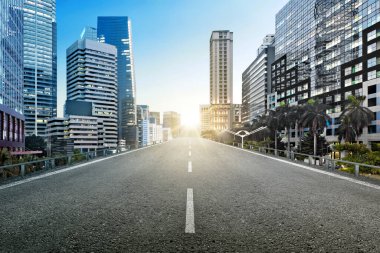 Asphalt road with modern buildings and skyscrapers on the midtown