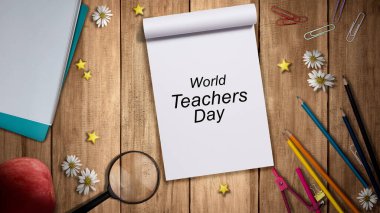 Okul kırtasiyesi ve kitap ahşap masada. Dünya Öğretmenler Günü konsepti.