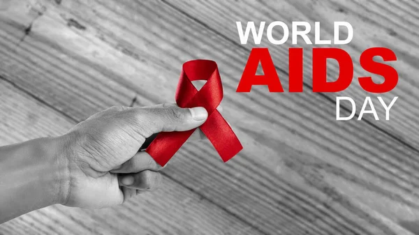 Human Hand Showing Red Ribbon Awareness World Aids Day Concept — Stock Photo, Image