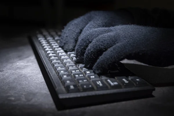 Hacker hand typing on a computer keyboard. Cyber Security concept