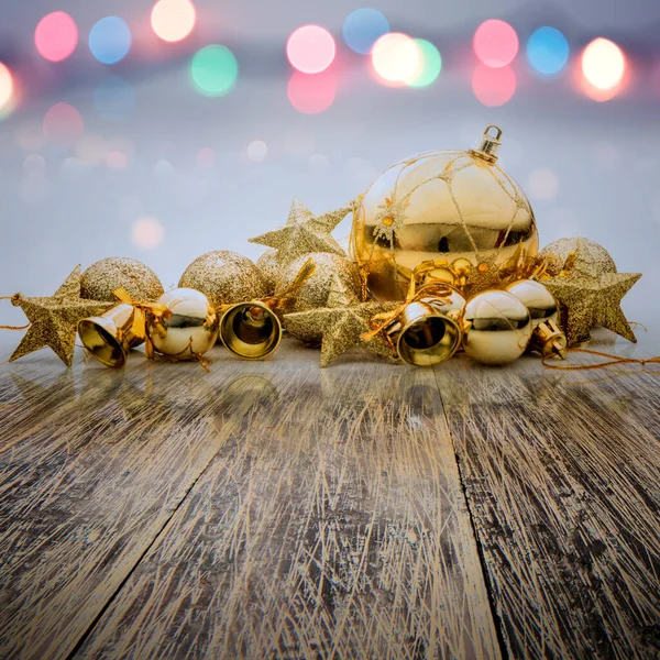 Christmas ornament on wooden table with blurred lights background. Celebration background